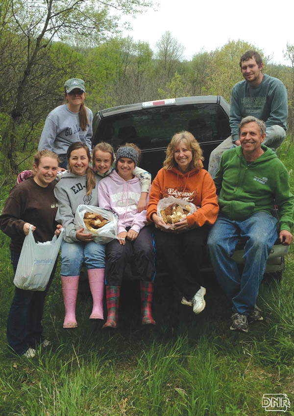 Jim and Jody Kerns’ belief in conservation and education is as deeply rooted as the trees that protect the banks along their Volga River property. Jim and Jody with their 6 children mushroom hunting | Iowa DNR